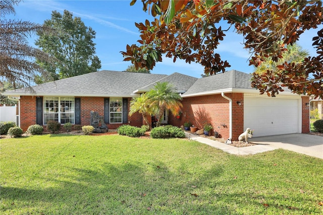 ranch-style house featuring a garage and a front lawn