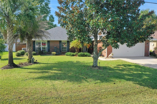 view of front of house featuring a front yard and a garage