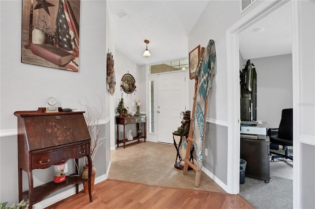 foyer with hardwood / wood-style flooring