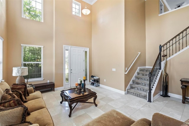 living room with light tile patterned floors and a towering ceiling