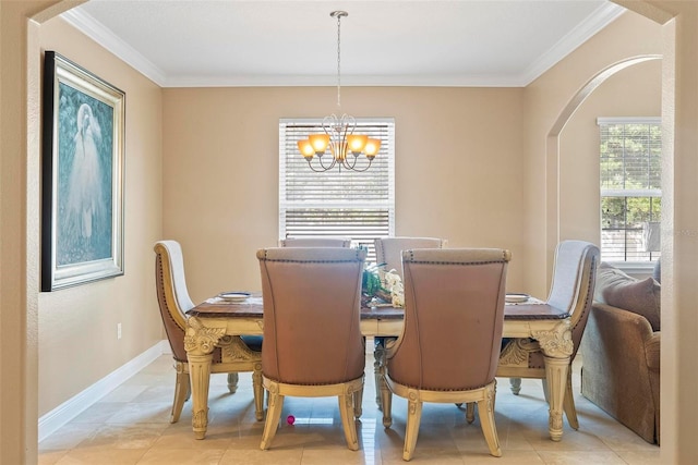 tiled dining room featuring crown molding and an inviting chandelier