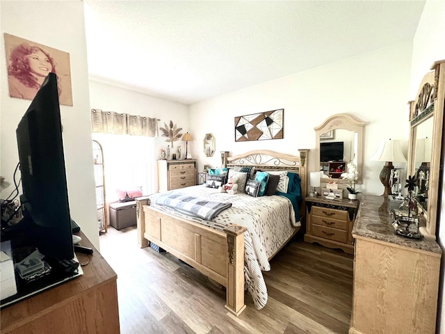 bedroom featuring hardwood / wood-style floors