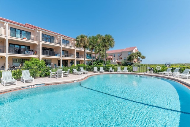 view of swimming pool with a patio area