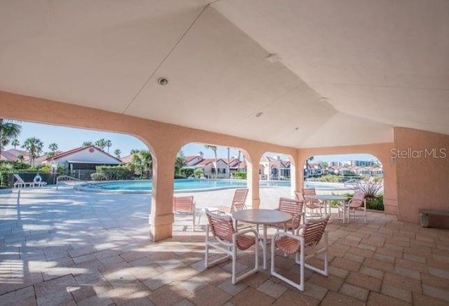 view of patio featuring a community pool