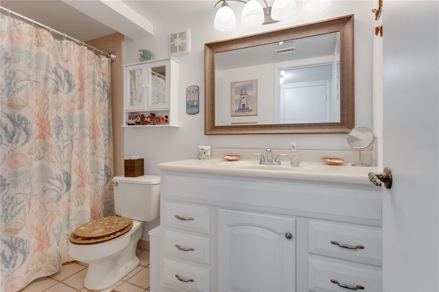 bathroom with toilet, a shower with curtain, vanity, and tile patterned floors