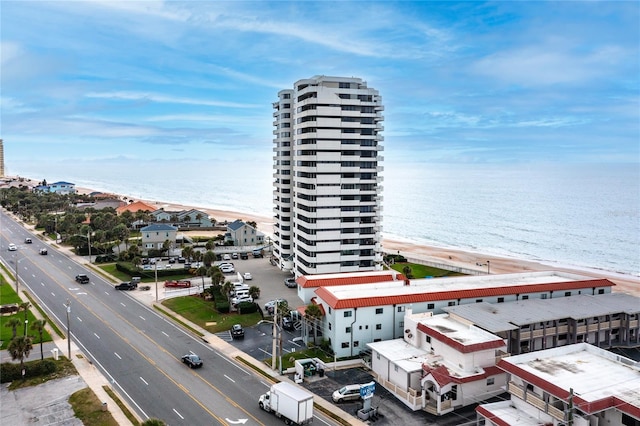 bird's eye view with a beach view and a water view