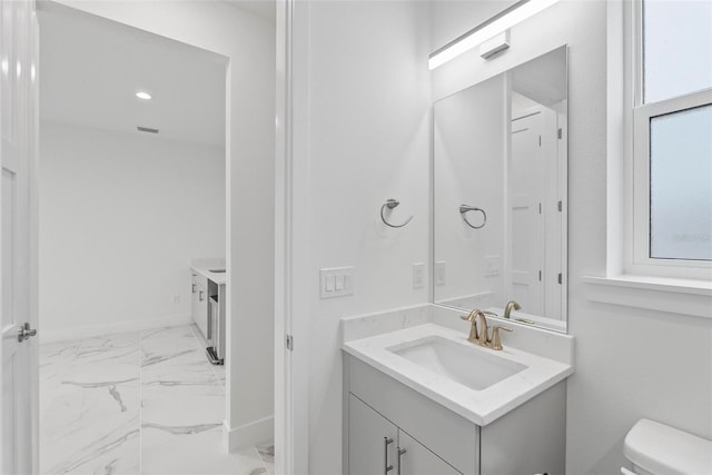 bathroom with vanity and toilet