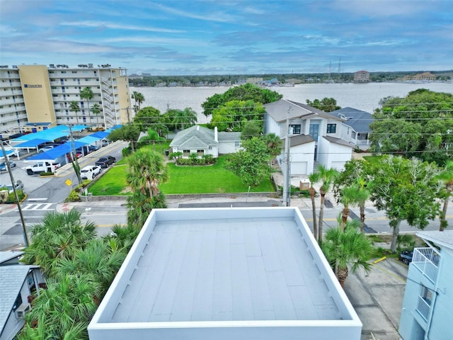 birds eye view of property with a water view