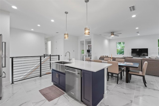 kitchen featuring ceiling fan, hanging light fixtures, sink, a center island with sink, and appliances with stainless steel finishes