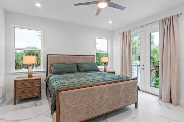 bedroom featuring ceiling fan, multiple windows, and access to outside