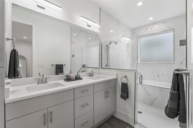 bathroom with vanity, hardwood / wood-style floors, and an enclosed shower