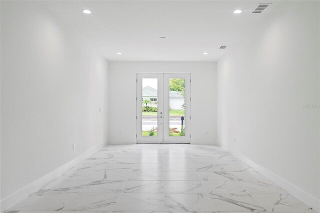 empty room featuring french doors