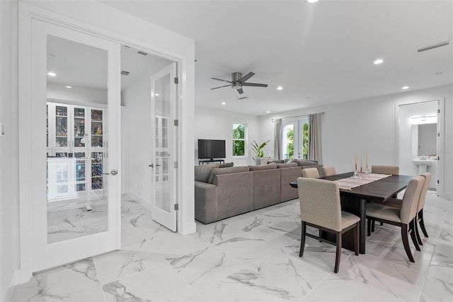 dining area featuring french doors and ceiling fan