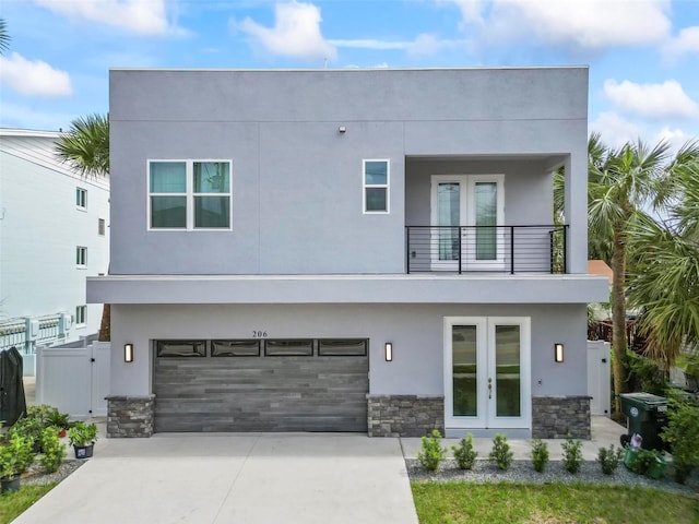 contemporary house featuring a balcony and a garage