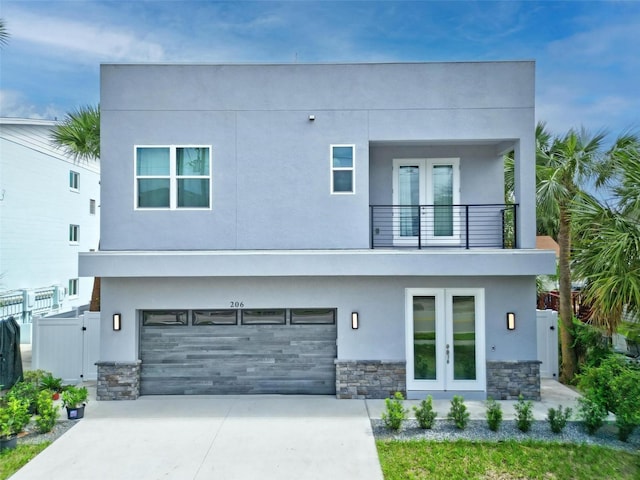 contemporary home with a balcony and a garage