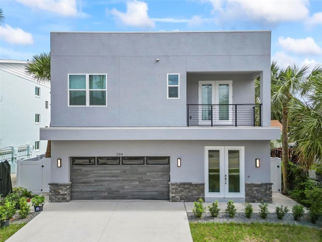 contemporary home with a balcony and a garage