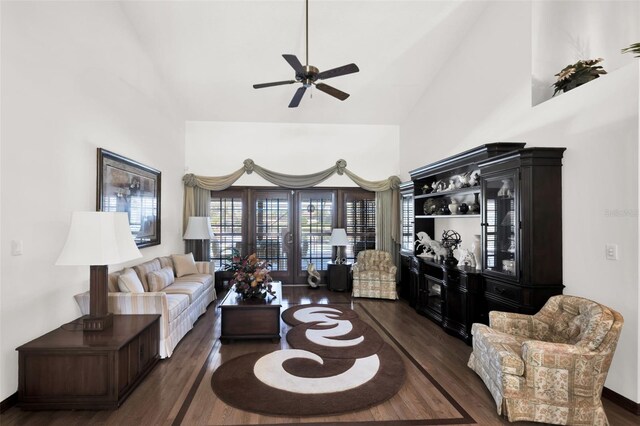 living room featuring high vaulted ceiling, ceiling fan, and dark hardwood / wood-style flooring