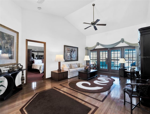 living room with french doors, dark hardwood / wood-style floors, high vaulted ceiling, and ceiling fan