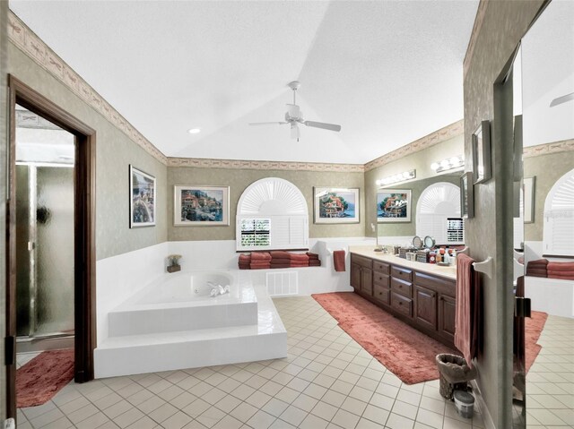 bathroom featuring lofted ceiling, ceiling fan, independent shower and bath, and vanity