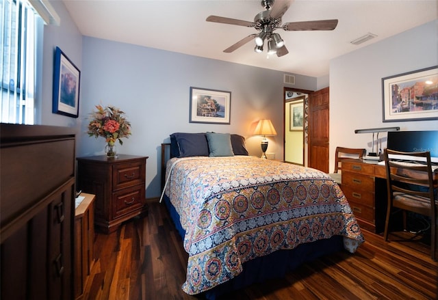 bedroom with ceiling fan and dark hardwood / wood-style floors