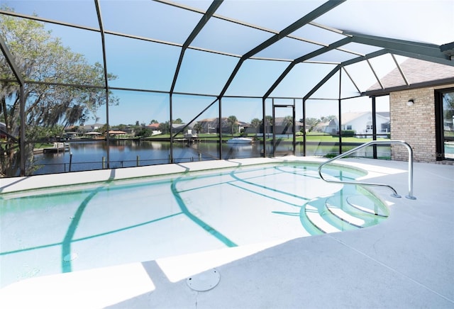 view of swimming pool featuring a water view, glass enclosure, and a patio area