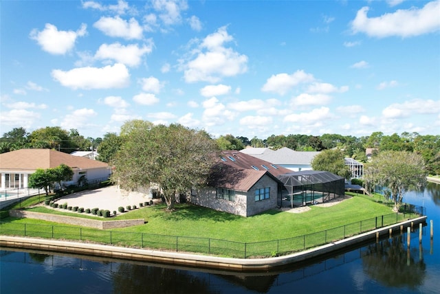 birds eye view of property with a water view