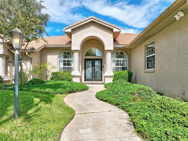 property entrance with a yard