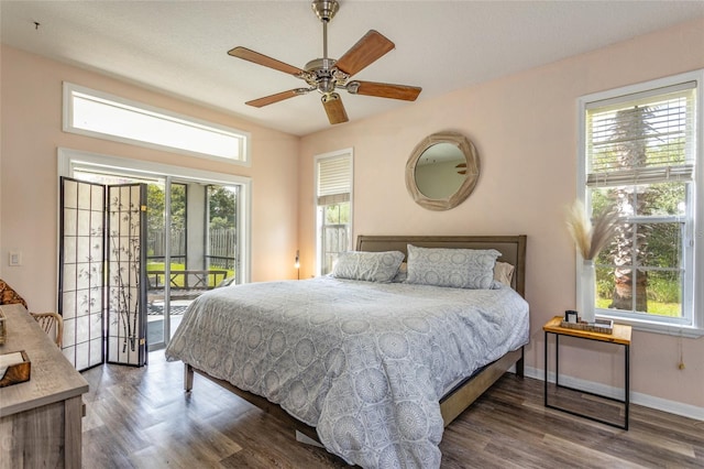 bedroom featuring ceiling fan, access to exterior, and dark wood-type flooring