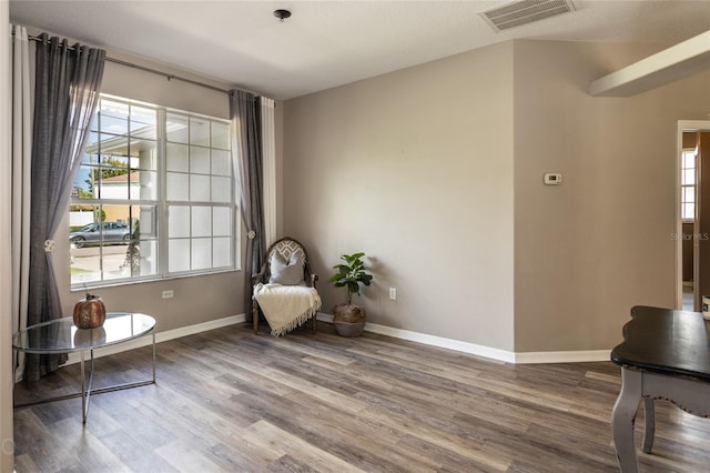 unfurnished room featuring hardwood / wood-style flooring