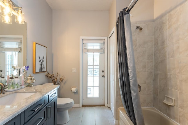 full bathroom with shower / bath combination with curtain, vanity, toilet, and tile patterned floors