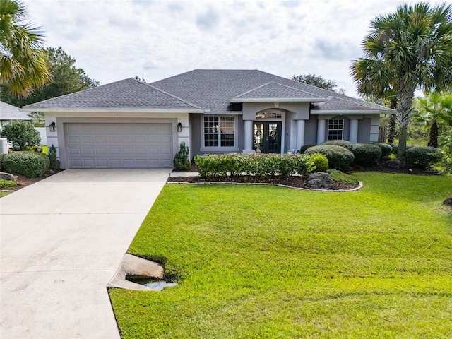 ranch-style house with a garage and a front lawn