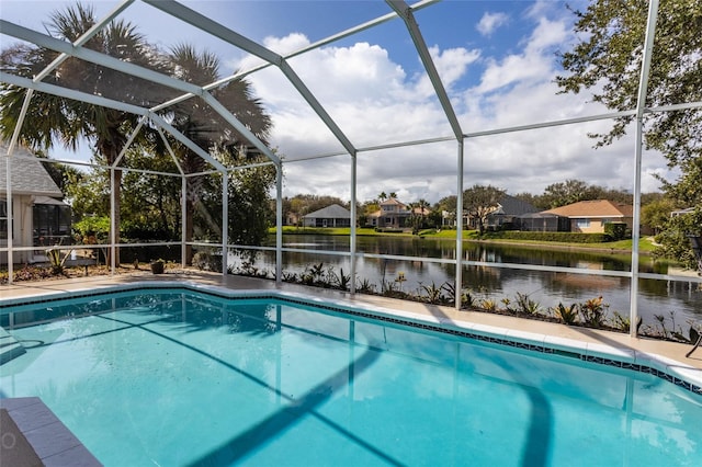 view of swimming pool with a lanai and a water view