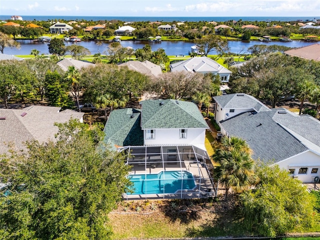 birds eye view of property with a water view