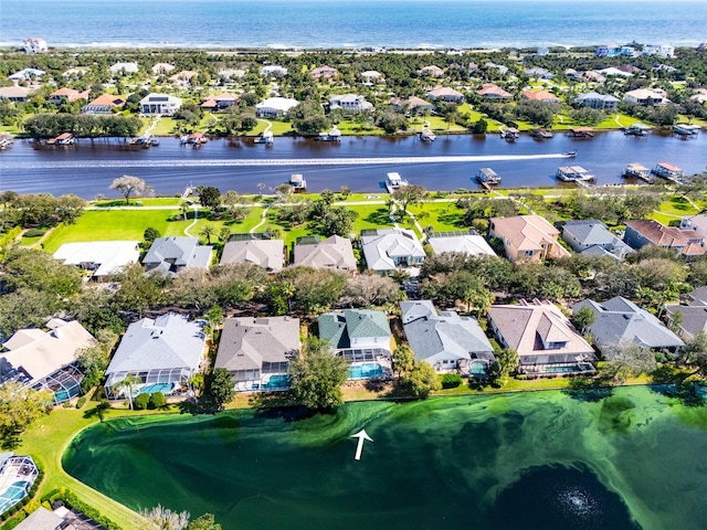 drone / aerial view with a water view