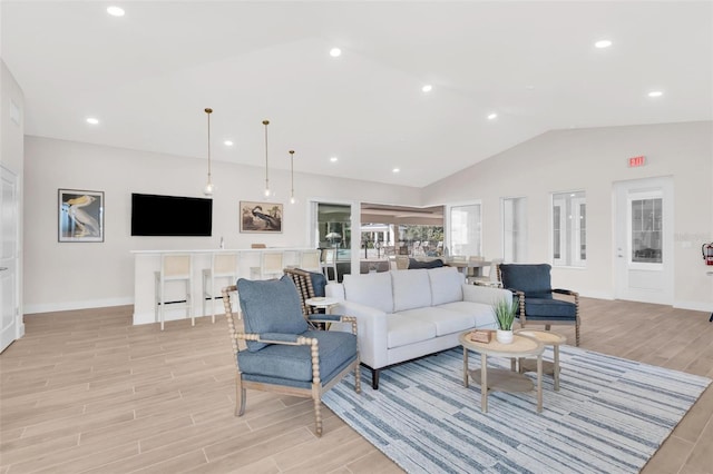 living room with lofted ceiling and light wood-type flooring