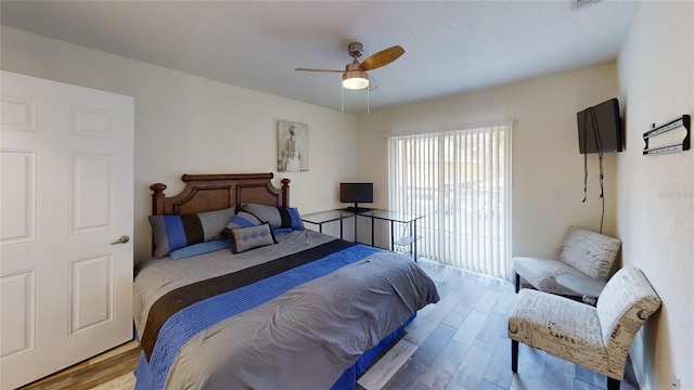 bedroom featuring ceiling fan and light hardwood / wood-style flooring