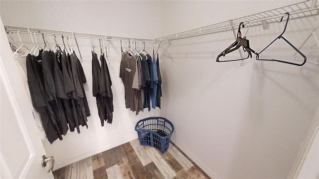 spacious closet featuring hardwood / wood-style flooring