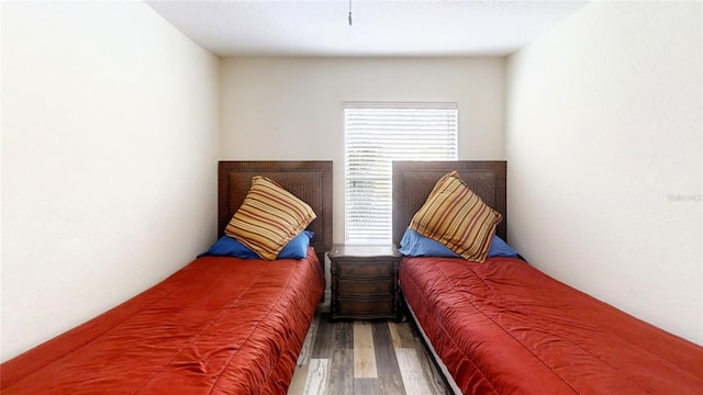 bedroom with hardwood / wood-style floors