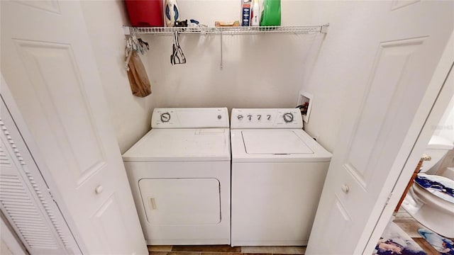 laundry room with independent washer and dryer