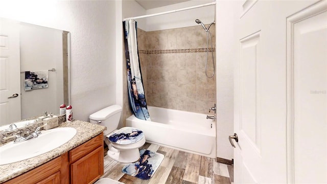 full bathroom with shower / tub combo with curtain, vanity, toilet, and hardwood / wood-style flooring