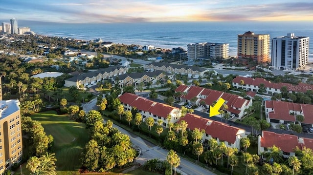 aerial view at dusk with a water view