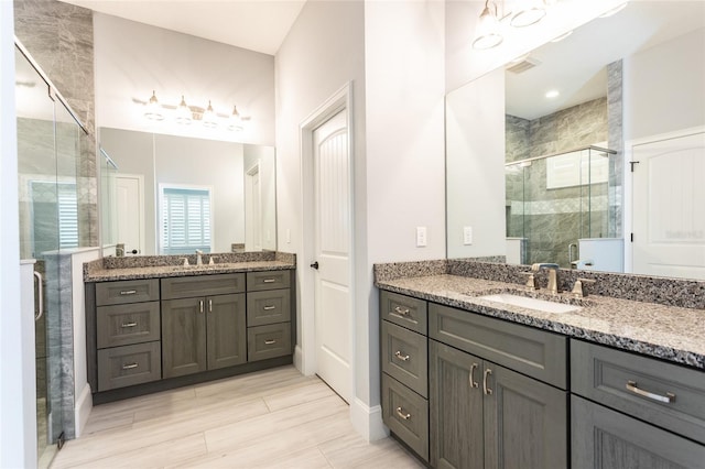 bathroom with vanity and walk in shower