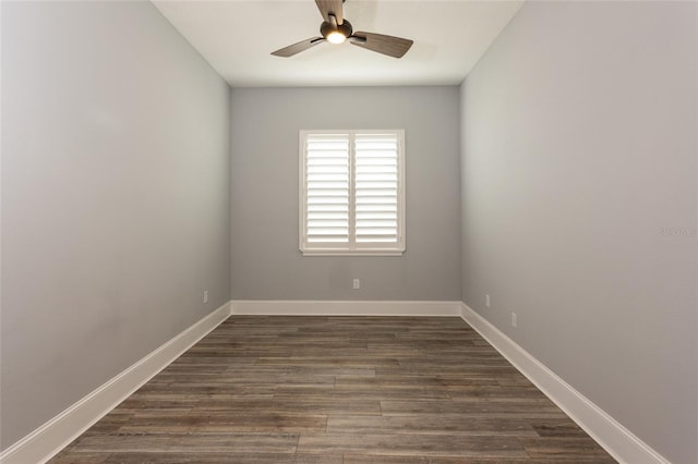 spare room featuring ceiling fan and dark hardwood / wood-style flooring