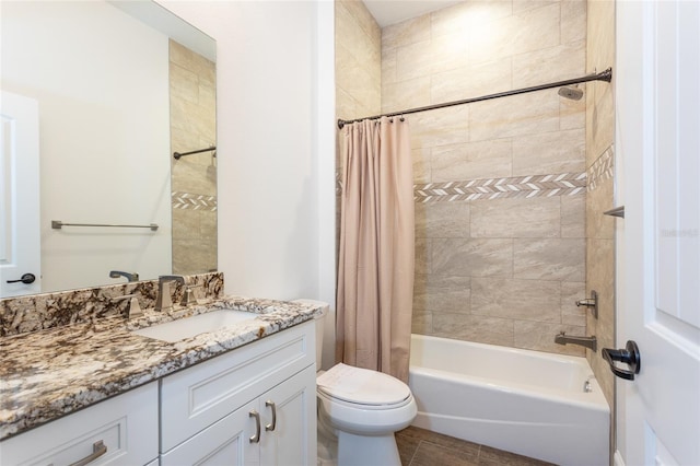 full bathroom featuring tile patterned flooring, shower / bath combo, vanity, and toilet