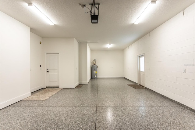 garage featuring a garage door opener and water heater