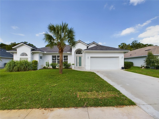 ranch-style home featuring a front lawn and a garage