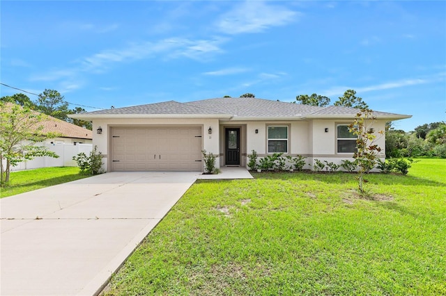 ranch-style home featuring a front lawn and a garage