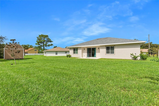 back of house featuring a yard