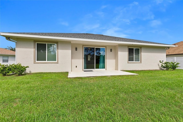 back of house featuring a yard