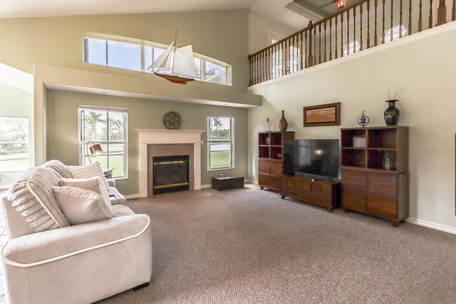 12 S Lakewalk Dr, Palm Coast, FL 32137 - carpeted living area featuring high vaulted ceiling, a tile fireplace, and baseboards